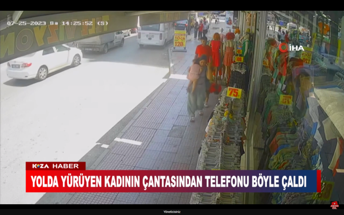 YOLDA YÜRÜYEN KADININ ÇANTASINDAN TELEFONU BÖYLE ÇALDI