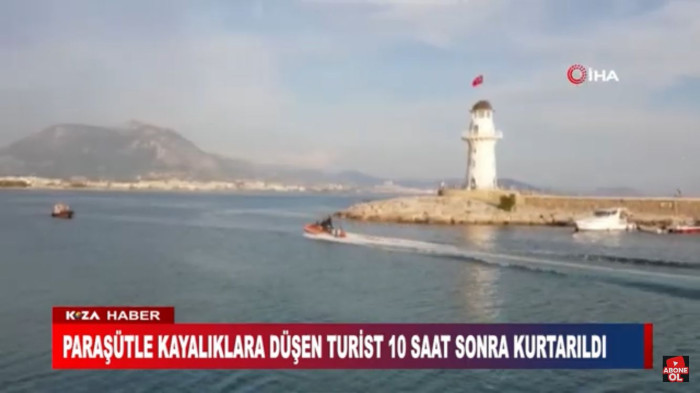 PARAŞÜTLE KAYALIKLARA DÜŞEN TURİST 10 SAAT SONRA KURTARILDI